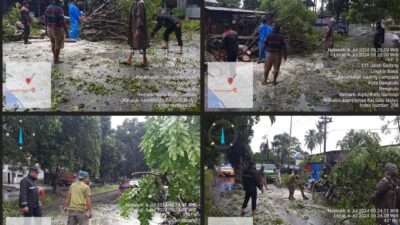 Personel Polsek Gading Cempaka bersama warga Evakuasi Pohon Tumbang yang Mengganggu Arus lalu lintas